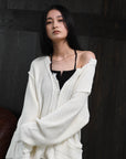 loose damaged cardigan