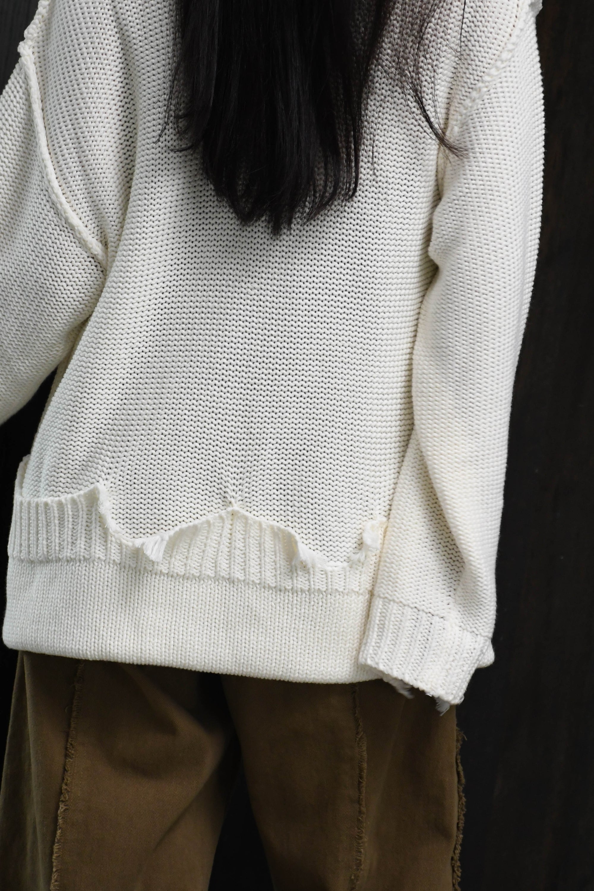 loose damaged cardigan