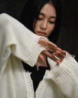 loose damaged cardigan